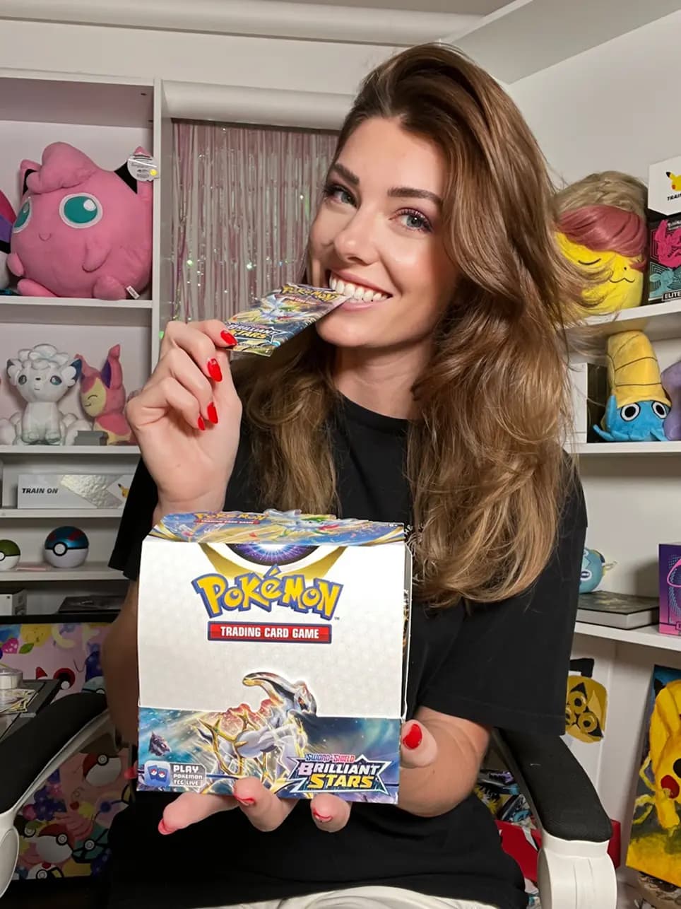 Palette Town artist Kelly Warpechowski holding a box of her original card illustrations